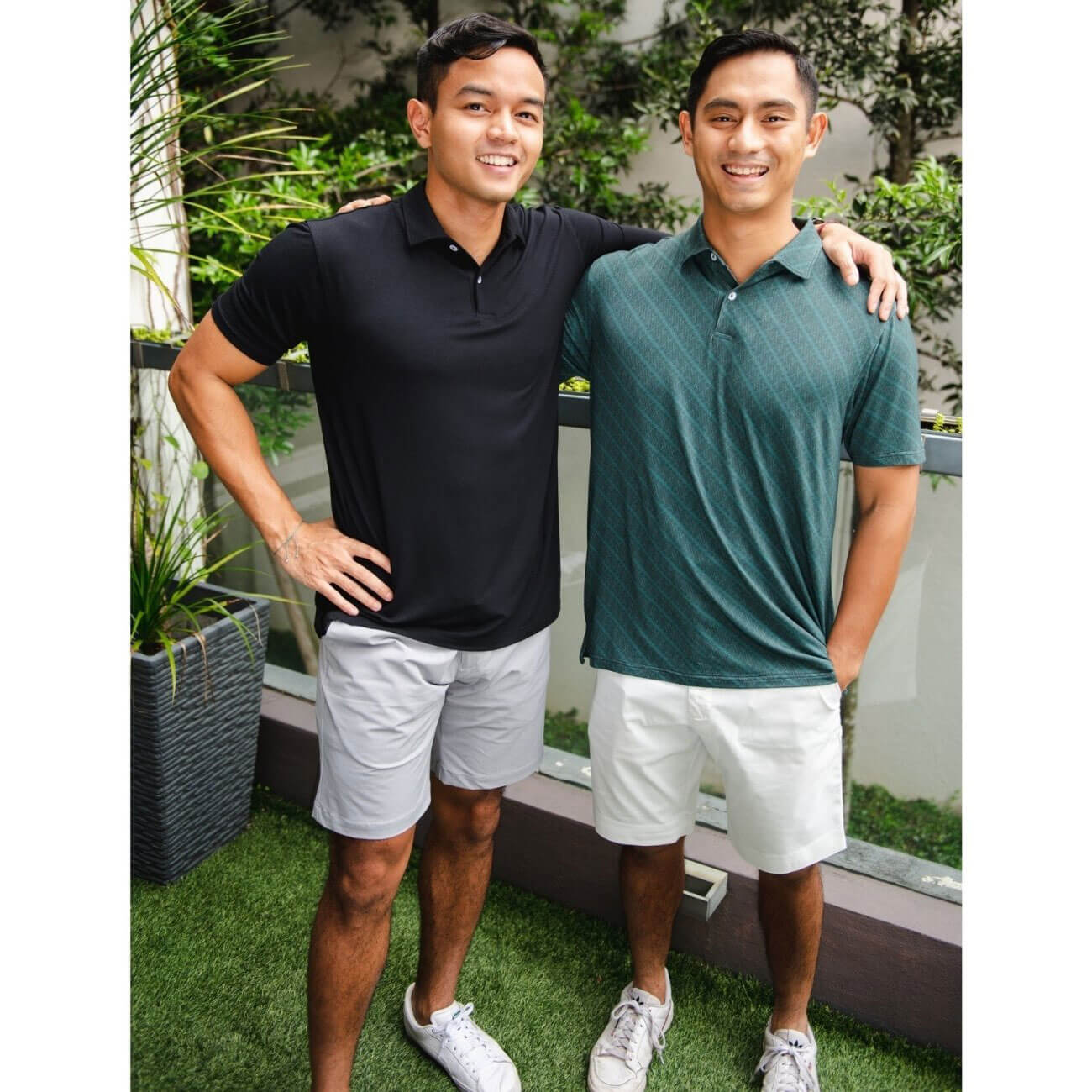 Kualesa Co-founders Ariff and Haris wearing Kualesa Solid Polo Black and Kualesa Batik Tribute Polo Parang Botanical Garden & Storm